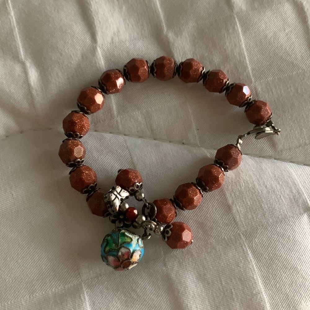 Sand stone bracelet with a little cool charms